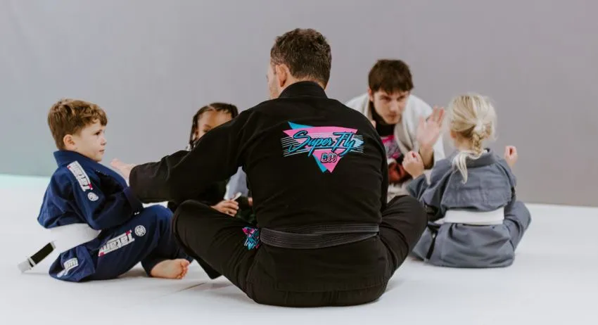 Young student staying calm while practicing Brazilian Jiu-Jitsu.
