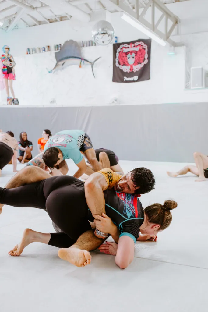 Two students sparring during a self-defense focused class at SuperFly BJJ in Decatur, GA.