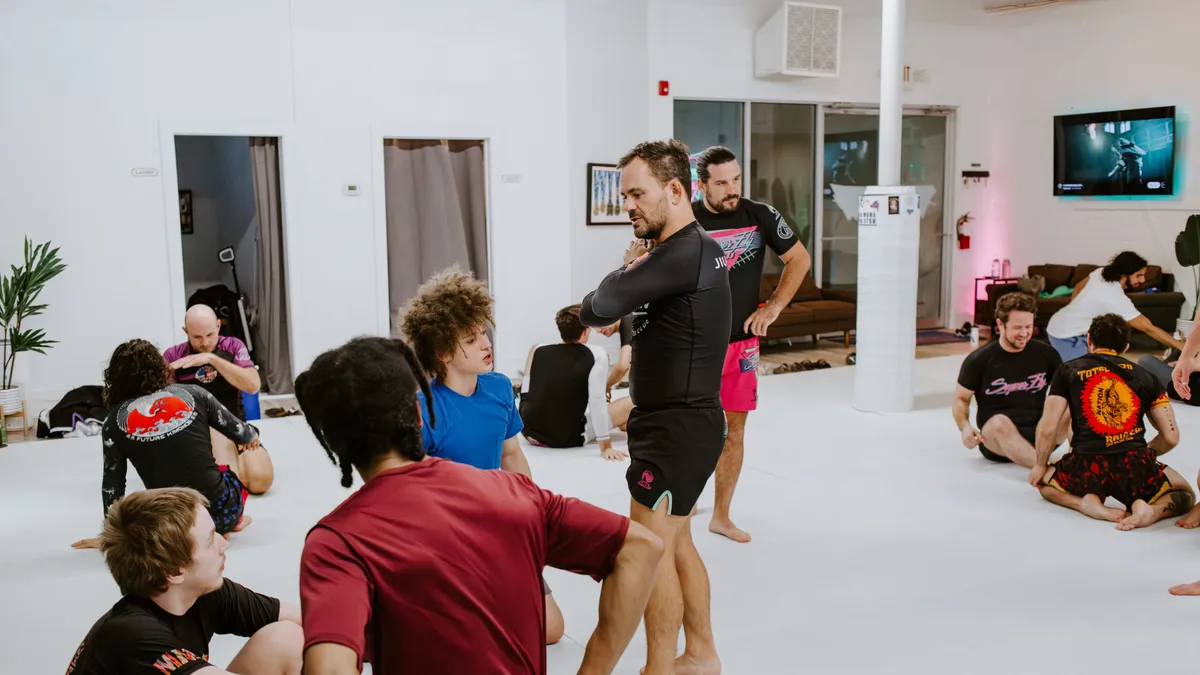 Adults training in a No-Gi Brazilian Jiu-Jitsu class at SuperFly BJJ in Decatur