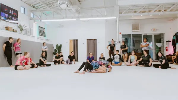 A female instructor demonstrating a technique in the women-only class
