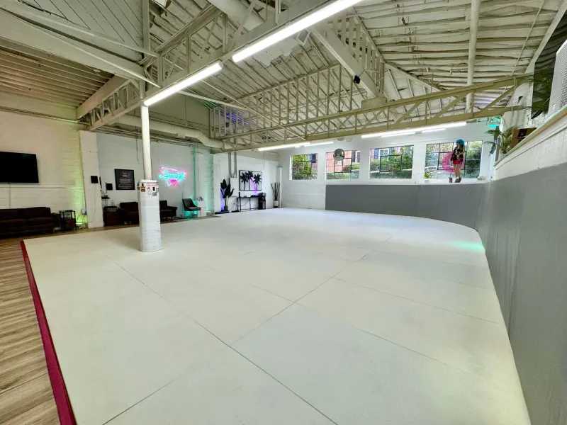 SuperFly BJJ training room with clean mat space and wall padding in Decatur, GA