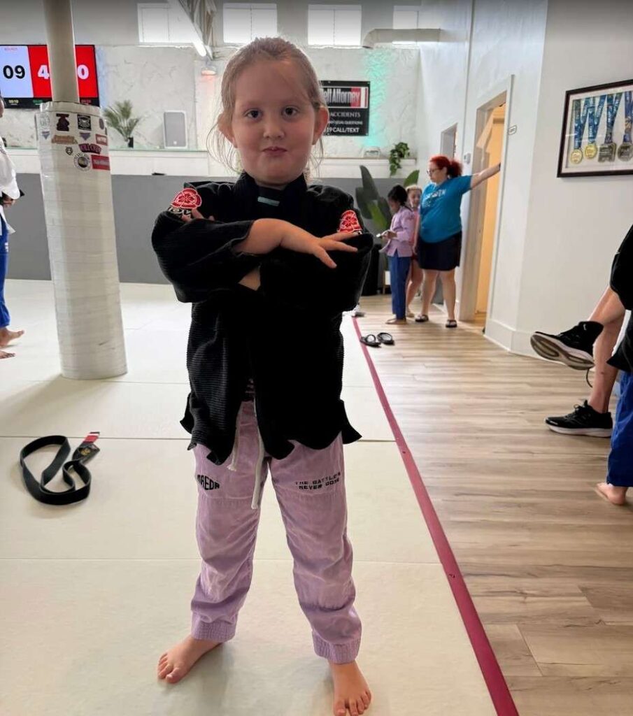 Happy parents and kids after Brazilian Jiu-Jitsu class at SuperFly BJJ.