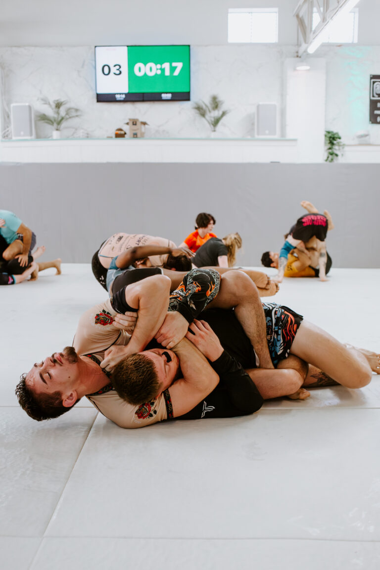 Two students sparring during a self-defense focused class at SuperFly BJJ in Decatur, GA.